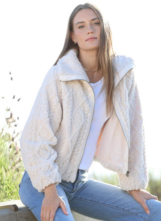 Model in the Dylan So Cozy Cable Jacket with a white tee and jeans