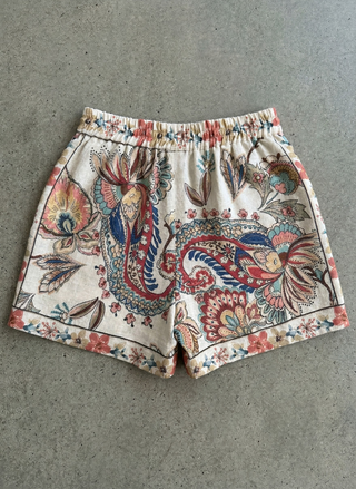 Patterned shorts on a gray surface