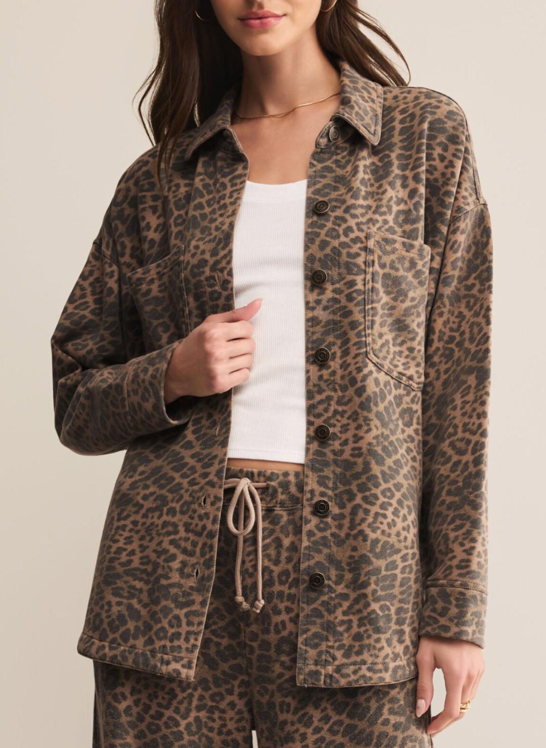 Woman wearing Z Supply All Day Knit Leopard Jacket in black and tan print, oversized fit with button-front closure and chest pockets.
