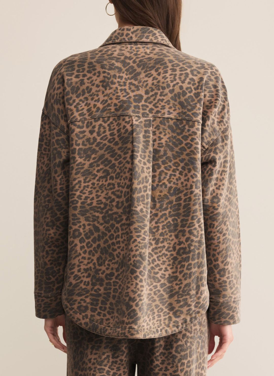 Back view of Z Supply All Day Knit Leopard Jacket in black and tan leopard print, relaxed oversized fit with curved hemline and drop shoulders
