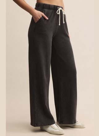 Full view of Z Supply Hunter Sweatpant in washed black, wide-leg silhouette with side pockets and relaxed fit.
