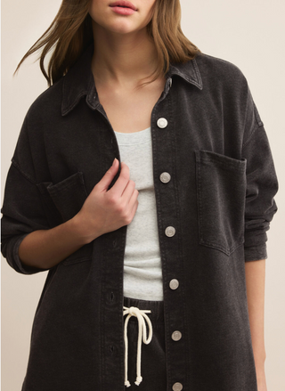 Close-up of Z Supply All Day Knit Jacket in washed black, featuring button-front closure, collared neckline, and chest patch pockets.