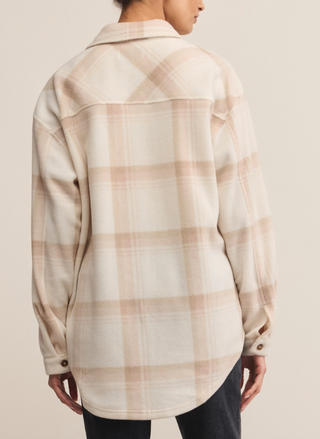 Back view of Z Supply Hiker Two Toned Fleece Jacket in beige plaid black jeans.