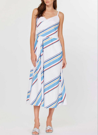 Front and back views of the Current Air Juliette V-Neck Wrap Midi Dress: a white cotton poplin midi dress with adjustable spaghetti straps, V-neck wrap bodice, sky blue/navy/red/beige diagonal stripes, smocked back panel, side seam zipper, and self-fabric waist tie, modeled with silver slide sandals.