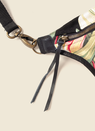 Casupo tropical upcycled canvas and leather fanny pack with brass hardware and adjustable black strap; handmade in Los Angeles with sustainable materials.