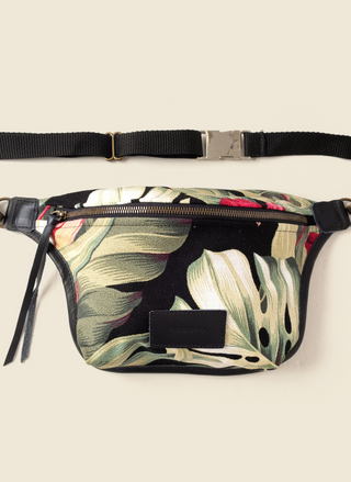 Casupo tropical upcycled canvas and leather fanny pack with brass hardware and adjustable black strap; handmade in Los Angeles with sustainable materials.