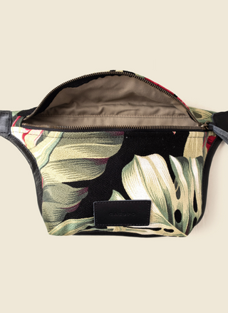 Casupo tropical upcycled canvas and leather fanny pack with brass hardware and adjustable black strap; handmade in Los Angeles with sustainable materials.