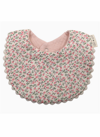 Floral patterned baby bib on a white background