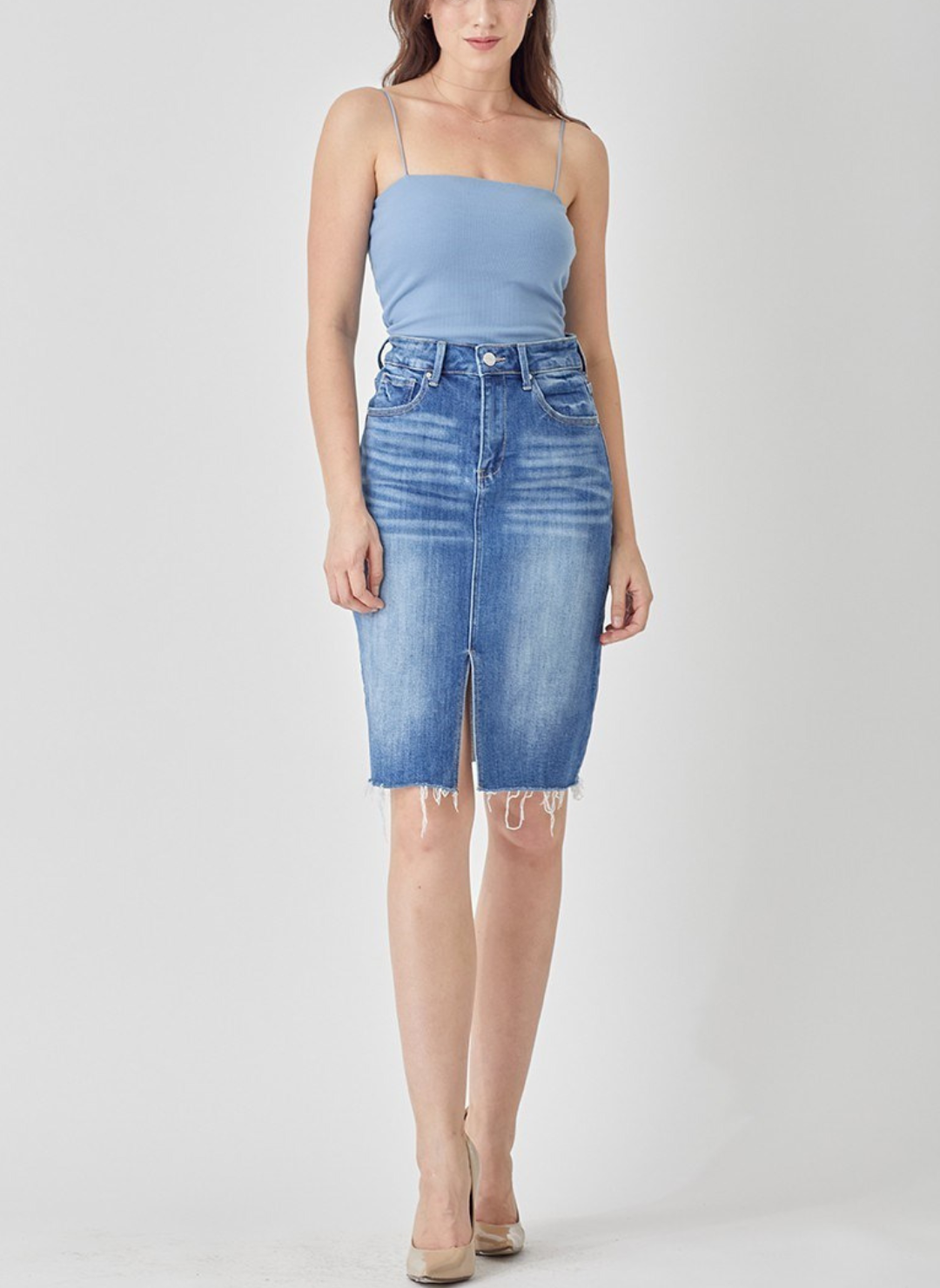 Tabitha high rise denim pencil skirt with front slit and raw hem in medium wash, hits above the knee, stretch fit.