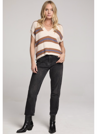 Saltwater Luxe Fitz Sweater Top featuring cream ribbed knit with camel and blue stripes, sleeveless V-neck design, drop-shoulder cap sleeves, and slightly cropped hem, paired with black jeans for a modern casual outfit.