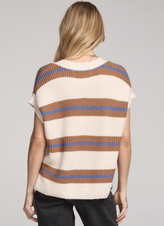 Back view of the Saltwater Luxe Fitz Sweater Top featuring cream ribbed knit with camel and blue stripes, sleeveless V-neck design, drop-shoulder cap sleeves, and slightly cropped hem, paired with black jeans for a modern casual outfit.