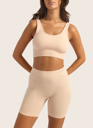 BOODY Smoothing Short in Nude, high-rise 6" inseam slip short with wide waistband and flat seams, invisible under clothing.