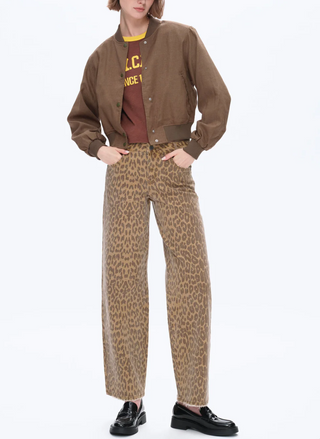 Mid Rise Leopard Straight jeans in tan and cocoa animal print, full-length straight leg with raw hem, styled with loafers and a cropped jacket.