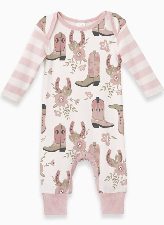 Baby onesie with cowboy boot and horseshoe pattern on a white background