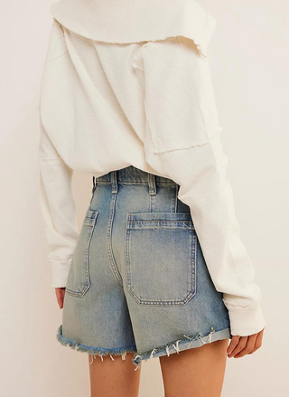 Back view of model wearing a Palmer Short FP with cropped sweatshirts. White background. 