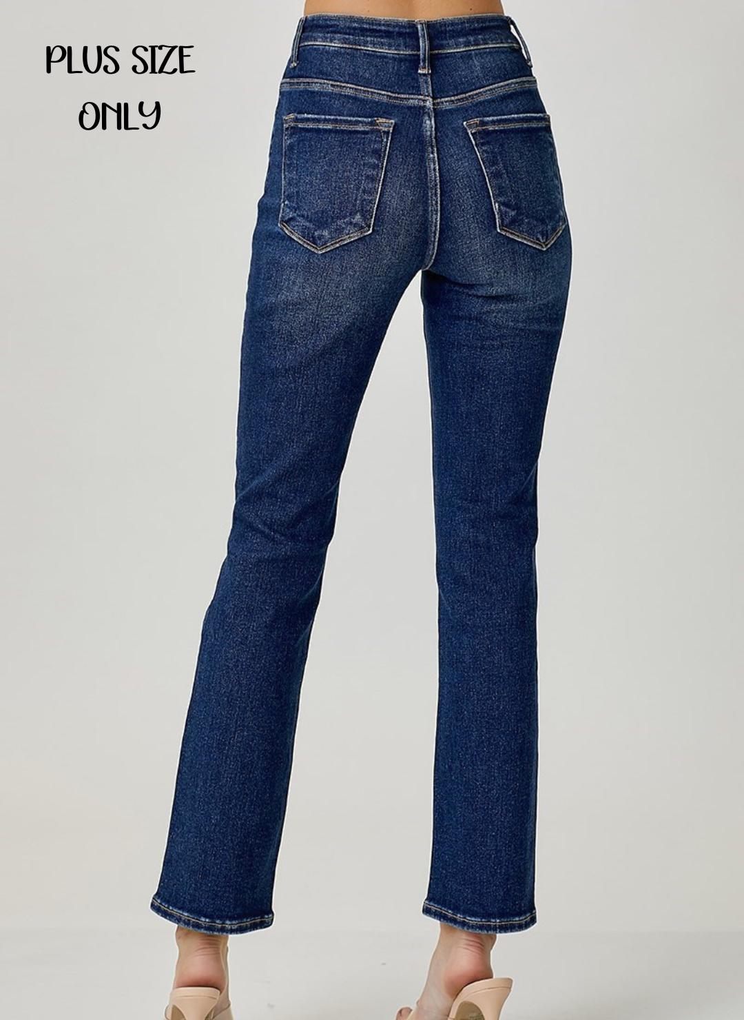 Back view of model wearing medium wash Mid Rise Ankle Straight Slim Denim. White background