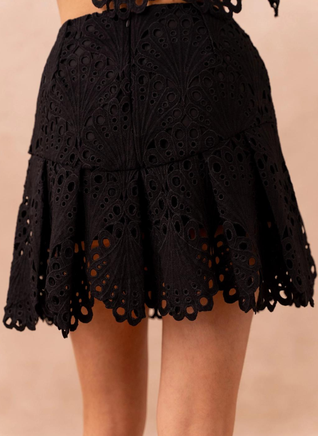 Close back view of model wearing Frenchy Lace Skirt.