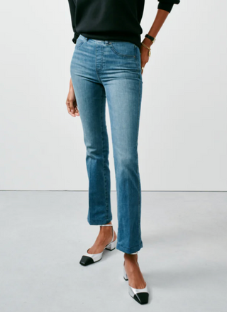 the model is showing the front of the pant and wearing a black shirt with these denim jeans
