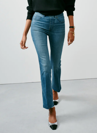 The model is in more of a walking motion in this picture showing us the Spanx stretch material