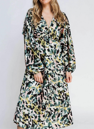 Front view of model wearing the ZHRILL Reflection Printed Dress. White background.