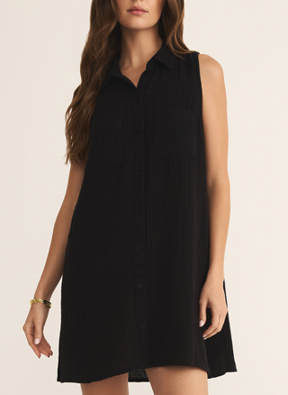 Z Supply New Light Mini Dress in black cotton gauze with sleeveless design, front button closure and patch pockets, available at August Boutique Ripon.