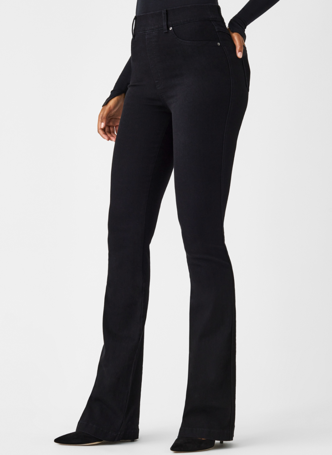 Close up front/side view of SPANX black denim jeans.