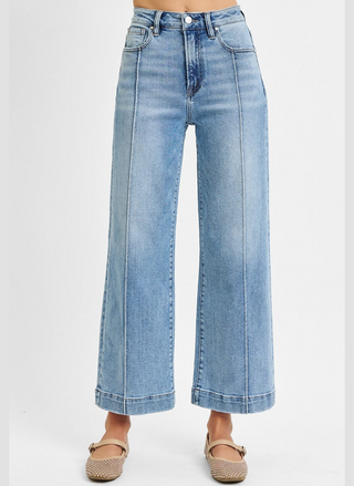 Light blue wide-leg jeans on a white background