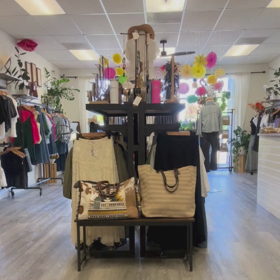 Video of model walking by inside of August Boutique.
