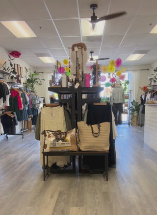 Video of model walking by inside of August Boutique.